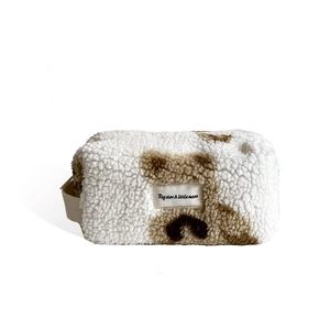 Fuzzy plush travel makeup bag with brown leopard spots and convenient carrying handle