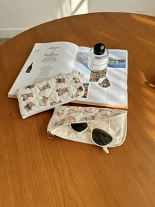 Quilted cotton storage bag with cute bear print showing interior capacity for sunglasses
