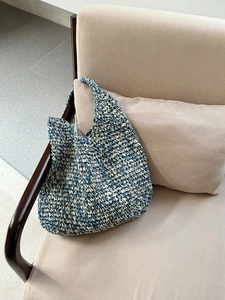 Handmade woven beach tote bag in blue and beige with spacious interior for travel