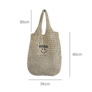 Detailed size specifications for hollow straw shoulder bag with black smile graphic