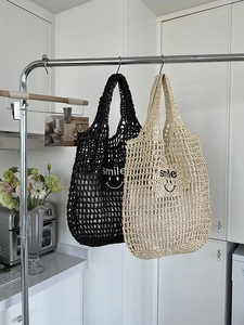 Detailed knit hollow bags in black and beige with smile embroidery and mesh texture