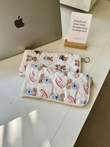 Quilted storage pouch featuring cute bear and poodle prints with metal zipper closure