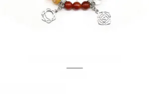 Detail of natural crystal beads bracelet with silver geometric hollow charm and green leaves