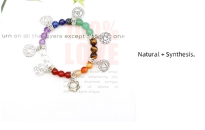 Detail view of chakra bead bracelet with seven chakra symbol silver metal pendants