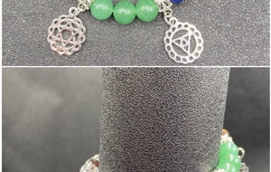 Close-up of a multi-color natural crystal chakra bracelet with a silver yoga mandala charm