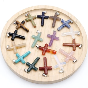 Assorted natural gemstone cross pendants featuring rose quartz and tiger eye stones