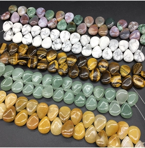 Polished teardrop natural stones set including tiger eye and aventurine crystals