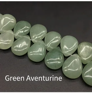 Macro detail of teardrop Green Aventurine stone beads showing polished texture