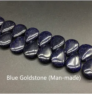 Macro shot of 13x18mm Blue Goldstone teardrop beads for DIY jewelry making