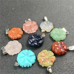 Detailed view of nine gemstone flower pendants in various colors like rose quartz and agate