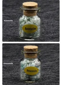 Detail view of mini glass jars with Aventurine and Amazonite crystal specimens