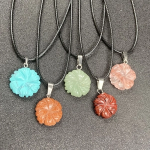 Carved stone flower pendants in five colors on black cord necklaces for women