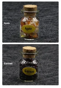 Detail of mini glass jars filled with natural Agate and Garnet crystal stone specimens