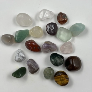 Close-up of colorful polished crystal stones including tiger eye and amethyst