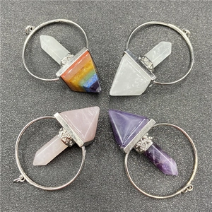 Detailed view of four chakra crystal hexagonal pendants with silver metal clasps