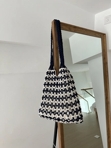 Detail of navy and white hand-woven macrame tote bag with cotton mesh and soft lining