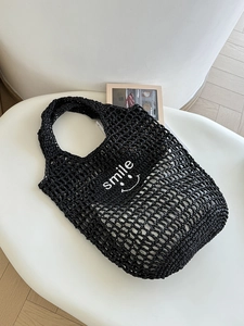 Minimalist black crochet tote bag with white smile embroidery and inner lining for beach