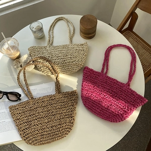 Three hollow straw tote bags in beige brown and purple for summer beach vacations