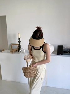 Chic summer vacation look featuring hollow straw tote bag and matching sun hat