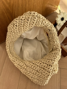 Beige handmade woven cloud shoulder bag with inner lining and zipper closure