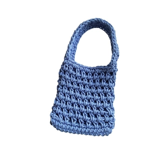 Light blue handmade crochet handbag with thick cotton rope and woven handle design