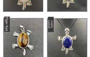 Detailed turtle brooch with natural tiger eye and lapis lazuli gemstone inlay