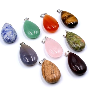 Set of nine teardrop-shaped natural crystal stone pendants with silver metal clasps