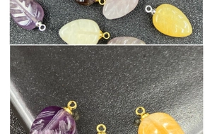 Macro detail of leaf-shaped natural stone pendants with intricate vein carvings