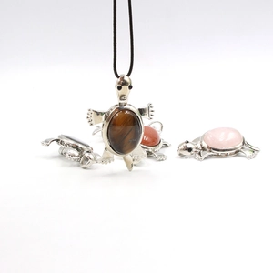 Tortoise brooch pendant with natural tiger eye and rose quartz stones on a silver base