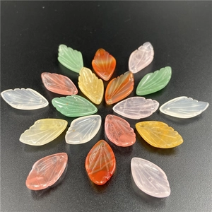 Macro shot of hand-carved leaf-shaped natural stone beads for DIY jewelry making