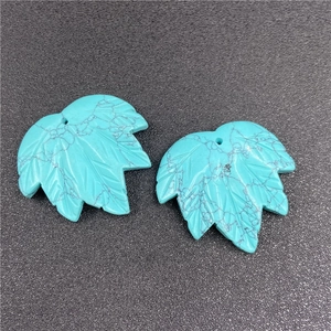 Detail of leaf-shaped turquoise stones with natural patterns for DIY jewelry making