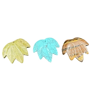 Maple leaf shaped natural stone pendants featuring Tiger Eye and Turquoise stone textures