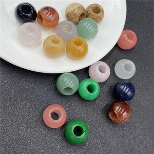 Close-up of polished 20mm natural stone beads with large holes for DIY jewelry