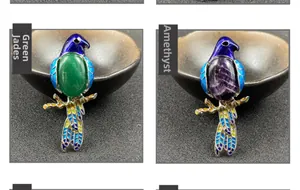 Detail of bird brooches featuring green aventurine and amethyst with enamel accents