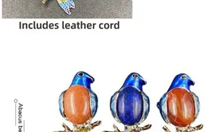 Detail of vintage kingfisher brooches featuring colorful enamel and natural gemstones
