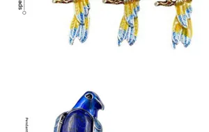 Detailed view of colorful enamel magpie pendants with inlaid gemstones and vibrant bird motifs