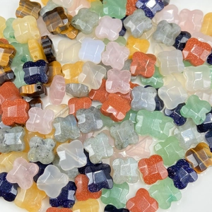 Mix of colorful clover-shaped gemstone beads for jewelry making including rose quartz and aventurine