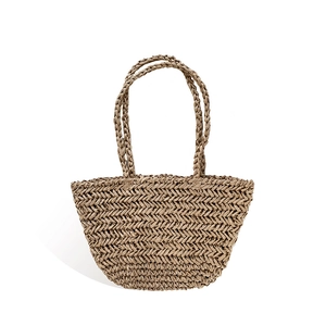 Minimalist straw tote bag with fishtave weave and woven handles for summer beach vacations