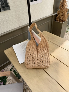 Macro shot of large capacity woven tote bag showing v-shape hollow out crochet texture