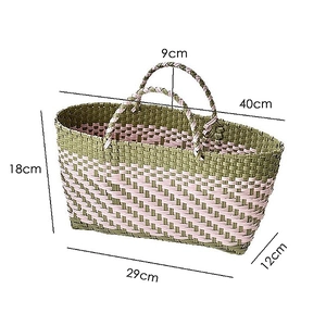 Detailed view of green and pink hand-woven shopping bag with size measurements