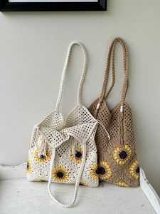 Handmade crochet tote bag with sunflower pattern and fringe tassels for beach vacations