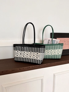 Detail of woven tote bags showing intricate checkerboard and striped waterproof textures