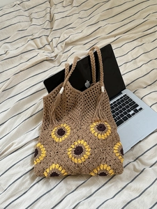 Handmade coffee crochet tote bag with yellow sunflower patterns and bohemian tassel detail