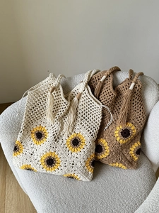 Handmade crochet sunflower shoulder bag in cream and brown with woven tassel handles