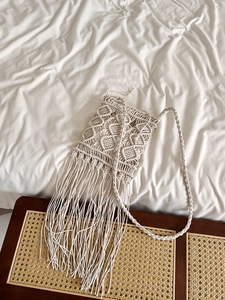 Handmade macrame tassel crossbody bag in cream white with woven geometric patterns