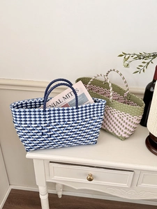 Handmade woven tote bags in blue and pink checkered patterns for shopping and storage