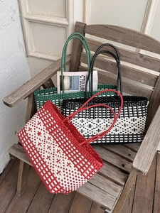 Woven tote beach bag in multi-color lattice patterns for seaside summer vacation