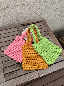 Handmade crochet hollow mesh tote bags in pink yellow and green for summer beach vacation