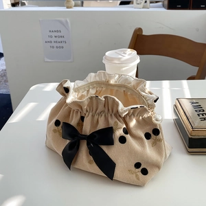 Beige corduroy cherry print pouch with black bow and elegant pearl zipper pull
