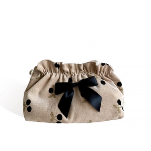 Corduroy makeup bag with cherry pattern, large black satin bow and pearl charm